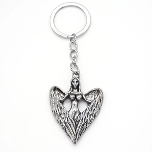Porte-clés ailes d'ange en alliage argenté vintage avec pendentif sculptural créatif
