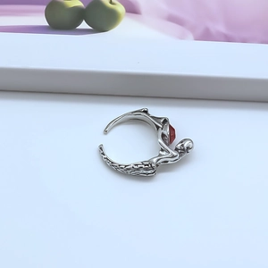 Punk style skull open ring in vintage silver with a striking red teardrop gemstone