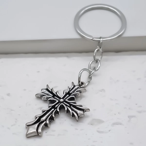 Vintage gothic cross metal keychain with distressed finish for backpacks and keys
