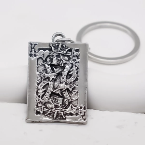 Vintage silver King of Spades pendant keychain with embossed playing card design