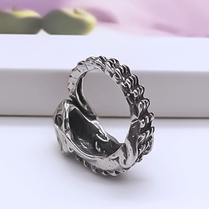 Macro detail of vintage punk eagle beak ring showing textured silver alloy and gothic relief
