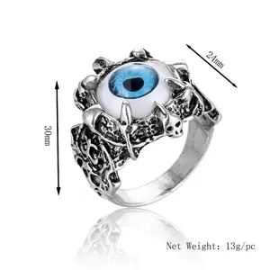 Vintage gothic evil eye ring with blue eyeball and skeleton details in antique silver finish