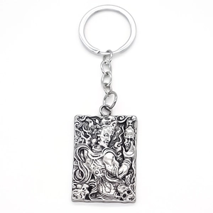 Retro square alloy keychain with embossed mythological figure and silver totem pendant