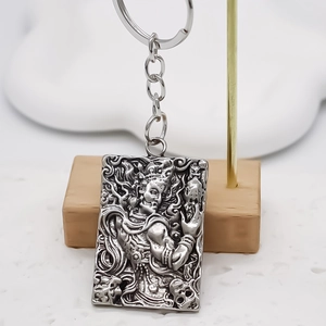 Retro square alloy pendant keychain featuring a detailed mythological totem relief