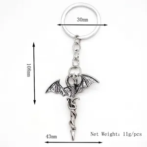 Porte-clés pendentif dragon et épée rétro avec détails en métal de style punk vintage