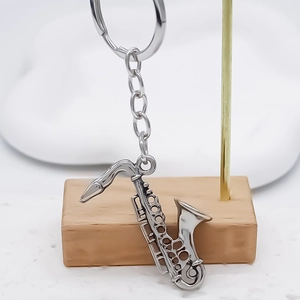 Polished silver saxophone keychain pendant with detailed realistic instrument design