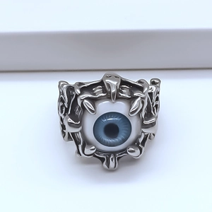Detailed view of vintage silver evil eye ring featuring a realistic blue iris centerpiece