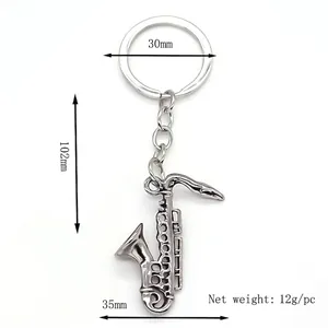Polished silver saxophone keychain with metal ring and realistic musical instrument pendant