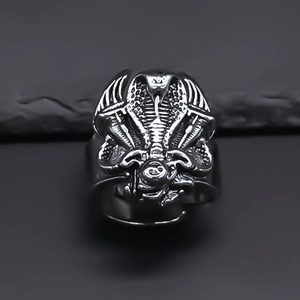 Macro shot of vintage silver cobra snake ring with gothic scales and wing details