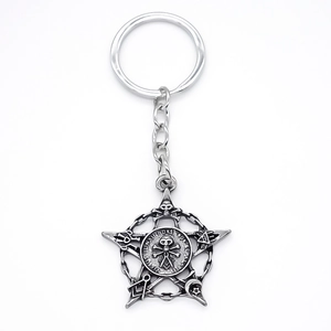 Vintage silver alloy keychain featuring mystic star pendant with occult symbols for backpacks