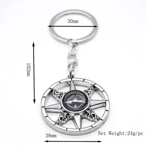 Retro silver compass keychain with nautical helm design and functional center dial