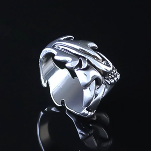 Vintage eagle claw silver ring with intricate feather carving and adjustable metal band