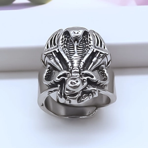Macro shot of punk cobra ring with detailed serpent scales and vintage silver finish