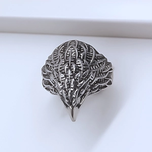 Macro view of detailed eagle head punk ring featuring vintage silver eagle feather texture