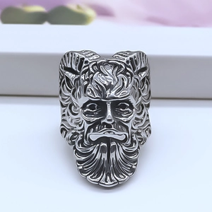 Detailed relief of horned mythological face on vintage silver adjustable ring for men