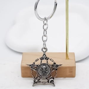 Vintage silver alloy keychain with masonic star pendant and celestial engravings