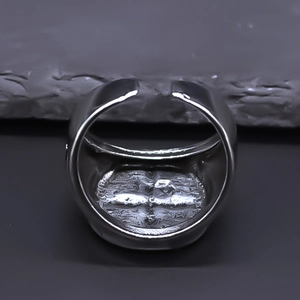 Detailed view of silver cross relief on a retro adjustable open ring for men