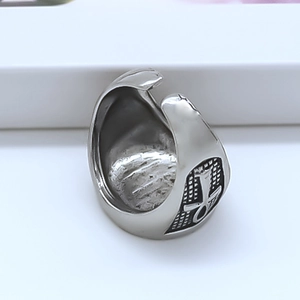 Macro view of adjustable silver ring featuring engraved Ankh cross symbols and vintage texture