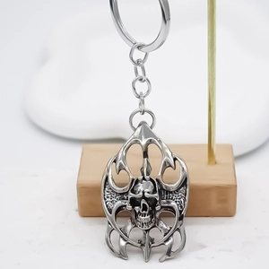 Gothic punk alloy skull keychain with vintage silver finish and retro flame frame design