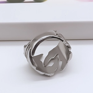 Detailed view of vintage silver eagle claw ring with artistic hugging hands design detail