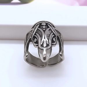 Macro detail of gothic alien totem ring with vintage silver finish and open band