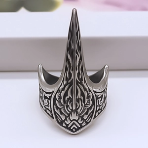 Detailed macro view of vintage silver punk ring with sharp claw and flame texture