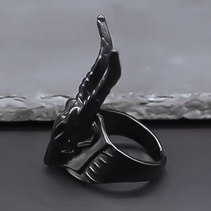 Macro shot of matte black goat horn ring featuring gothic punk style and sharp ridges
