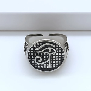 Vintage silver open ring featuring an engraved Eye of Horus on a textured round face