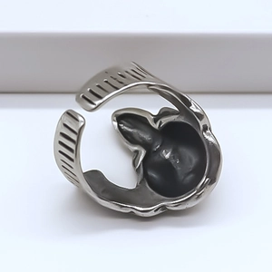 Detail of adjustable silver totem ring with side knurled texture and vintage finish