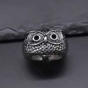 Vintage silver owl ring with detailed feather texture and adjustable open band design