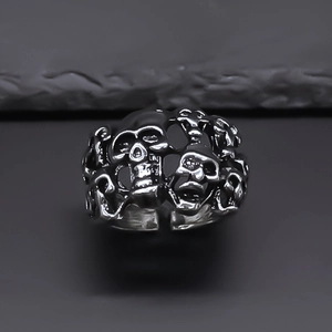 Retro punk style silver adjustable open ring featuring hollow gothic skull designs