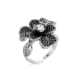 Retro silver floral open ring with black polka dots and a central sparkling crystal