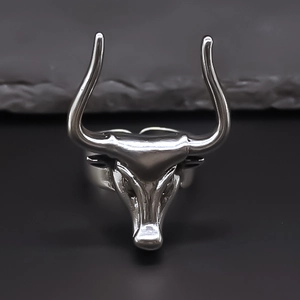 Macro shot of retro bull head ring with intricate metal horns and vintage silver finish