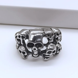 Macro shot of punk style silver skull ring with vintage distressed finish for men