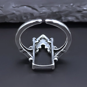 Detail of vintage silver adjustable ring featuring a gothic rectangular hollow design