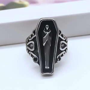 Detail of gothic coffin ring featuring 3D skeleton relief and ornate openwork patterns