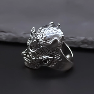 Dark gothic style silver-tone monster ring with horn details and vintage textured finish