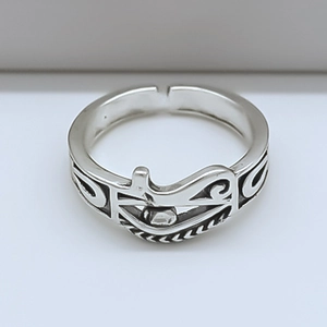 Close-up of vintage Eye of Horus engraving on silver adjustable ring with black oxidation