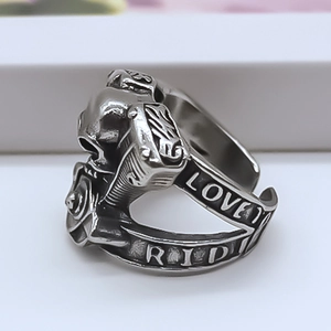 Macro detail of punk skull ring with engine engine parts and Love To Ride engraving