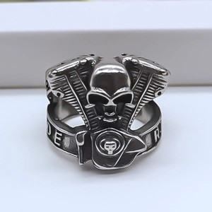 Macro view of punk skull ring featuring V-twin engine side motifs and RIDE engraving