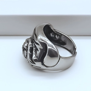 Detailed side view of vintage silver bulldog ring with intricate punk carving for men