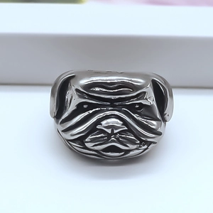 Macro detail of bulldog head punk ring featuring vintage silver finish and realistic textures