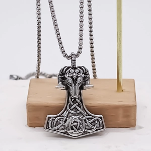 Vintage Mjölnir pendant necklace with ram head carving on a silver steel box chain