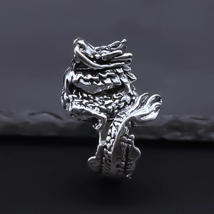 Detailed close-up of vintage silver dragon ring featuring intricate scales and craftsmanship