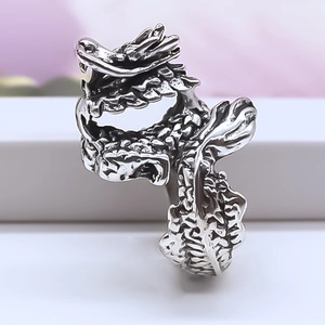 Macro shot showing detailed dragon scales and vintage finish of the adjustable ring