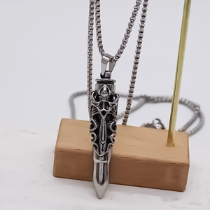 Gothic bullet pendant necklace with engraved cross detail on a stainless steel chain