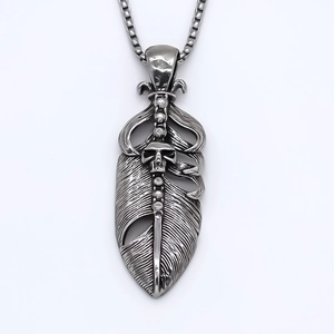 Vintage gothic feather pendant necklace with skull detail and silver square chain