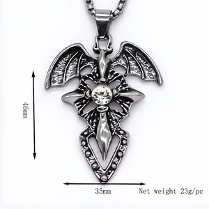 Gothic cross necklace with bat wings and center zircon stone, dimensions 46mm by 35mm