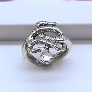 Macro shot of vintage silver octopus serpent ring showing detailed scales and textured layers