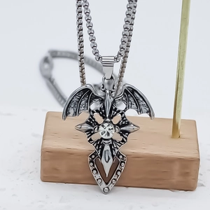 Gothic cross necklace with bat wings and sparkling rhinestone on a steel chain